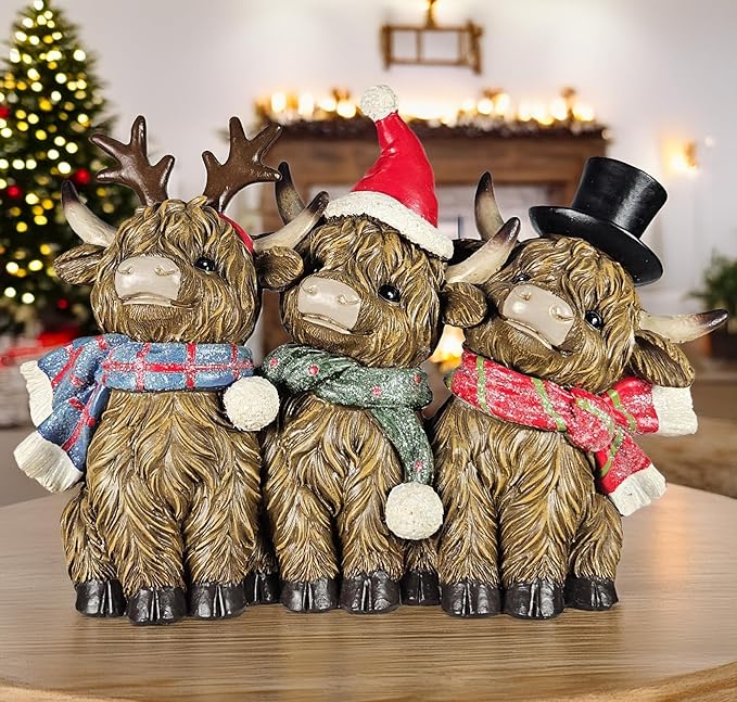 Scottish Holiday Highland Cows Trio with Christmas Accents | Resin Cows with Santa Hat & Antler Accents | Seasonal Xmas Decor for Centerpiece, Mantel, Kitchen, Dining Room, and More | 7 ½ inches tall