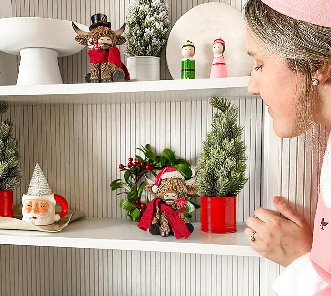 Holiday Scottish Highland Cows - Set of 2 | Resin Home Decor with Christmas Santa Hat Accents | Seasonal Xmas Decor for Centerpiece, Mantel, Kitchen, Dining Room, and More | 5 ¼ inches tall